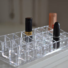 Close-up view of the acrylic lipstick holder, highlighting the clarity and design of the 24 sections